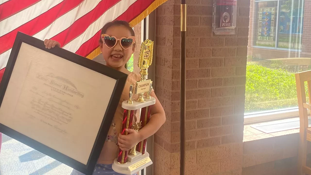 Child holding a trophy