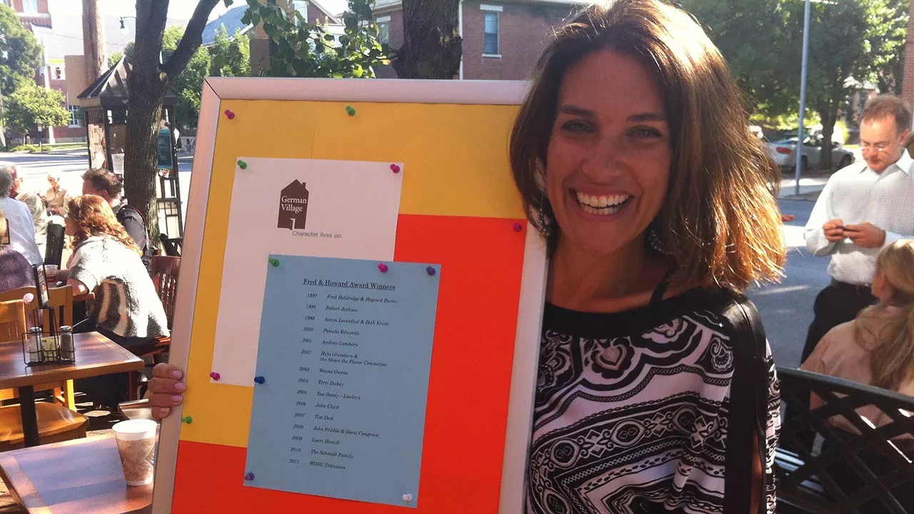 Sarah receiving the German Village Fred & Howard Award 