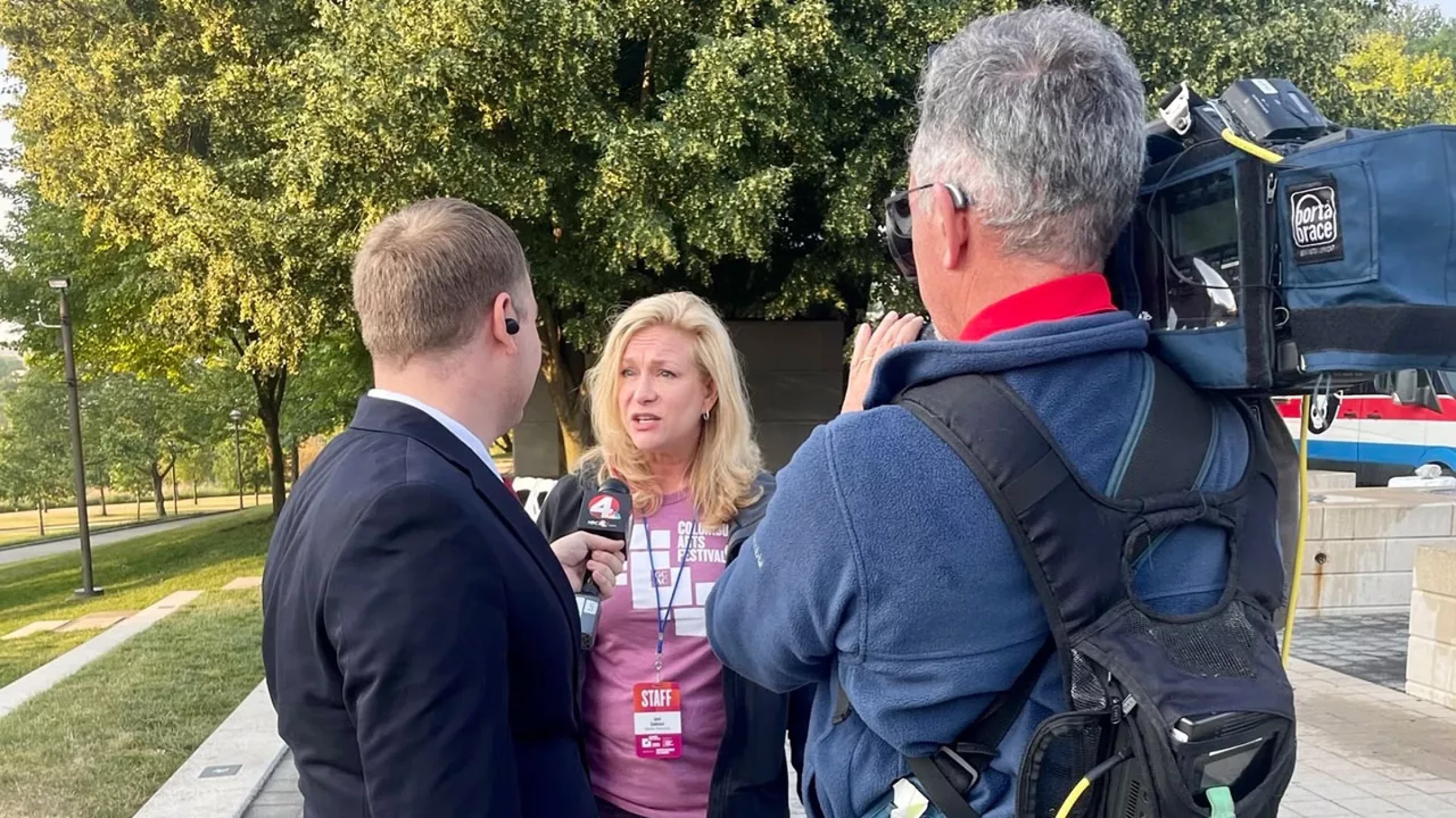 Jami Goldstein talking to reporters